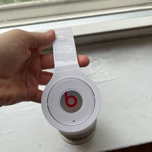 Beats by Dr. Dre wireless headphones in white with all accessories